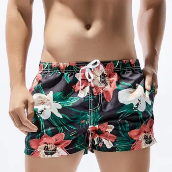 Mens לוח לשחות מכנסיים קצרים גברים החוף חליפת שחייה ברמודה גלישה קצרה פרחים דפוס כיס עיצוב לאדם ים חדר כושר ללבוש.